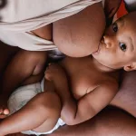 Breastfeeding Big Boobs: Holds & Practical Tips